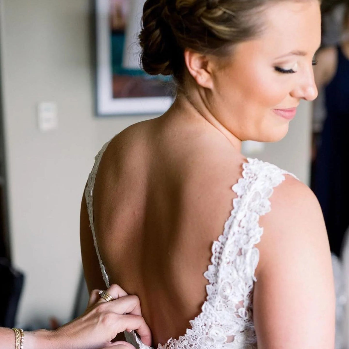 Bride in a lace gown with a polished updo at SALT Salon + Spa, Antioch IL